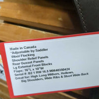 16.5 Adj *set XW *6.5" Schleese Obrigado Monoflap Dressage Saddle, Navy Schleese Cover, Wool Flocking, Shoulder Relief Panels, Rear Gusset Panels, Lg External Front Blocks, Flaps: 16"L x 10"W Serial #: B2 1 RW 16.5 M0640350424