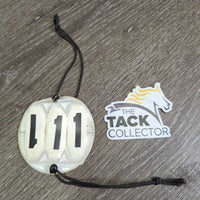 3# Round Horse Show Numbers, 2 thick elastics *gc/fair, discolored, yellowed, split edges, bent grommets
