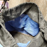 Round Grooming Bag, drawstring top, outer pockets, shoulder strap *gc/fair, clean, stains, v.hairy seams, rubs, v.cracked
