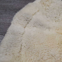 Sheepskin Quilt Half Pad, rolled edges *gc, clumpy, mnr hair, dirt, puckers, faded, threads, undone stitch, rubs