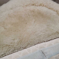 Sheepskin Half Pad *fair, clean, large bare spots, stains, clumpy, dingy, pills, mnr puckers, threads
