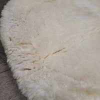 Shimmable Sheepskin Quilt Half Pad, rolled edge *gc, clean, 0 shims, cut tabs, v. stiff, shrunk, puckers, clumpy, mnr stains, pills, threads
