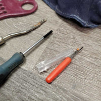 Braiding Kit: Stanley Box/Tray, 4 Combs, 2 Yarn, 2 Braid Guides, Pull Thru, Ripper, needle, elastics, 2 Pc suede belt, spray bottle, mini clippers (dont work)
