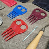 Braiding Kit: Stanley Box/Tray, 4 Combs, 2 Yarn, 2 Braid Guides, Pull Thru, Ripper, needle, elastics, 2 Pc suede belt, spray bottle, mini clippers (dont work)

