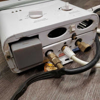 Propane Powered Tankless Wash/Shower Water Heater, hoses, Shower Head, Top Cover *gc, older, WORKS, dirt, scratches, stains
