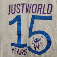 SS V Neck T-Shirt "JustWorld 15 Years" *gc, hair, mnr pilss & stains
