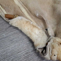Sheepskin Saddle Seat Cover *fair/poor, converted jacket? stains, clumpy, holes, thins spots, rubber tubing
