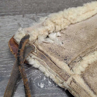 Sheepskin Saddle Seat Cover *fair/poor, converted jacket? stains, clumpy, holes, thins spots, rubber tubing
