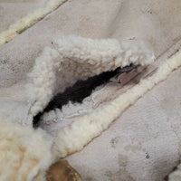 Sheepskin Saddle Seat Cover *fair/poor, converted jacket? stains, clumpy, holes, thins spots, rubber tubing
