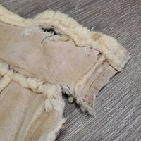 Sheepskin Saddle Seat Cover *fair/poor, converted jacket? stains, clumpy, holes, thins spots, rubber tubing
