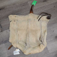 Sheepskin Saddle Seat Cover *fair/poor, converted jacket? stains, clumpy, holes, thins spots, rubber tubing
