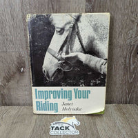 Improving your Riding with Janet Holyoake *fair, bent corners, faded, stains, cover: v.rubbed, torn & scraped, inscribed
