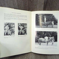 Improving your Riding with Janet Holyoake *fair, bent corners, faded, stains, cover: v.rubbed, torn & scraped, inscribed
